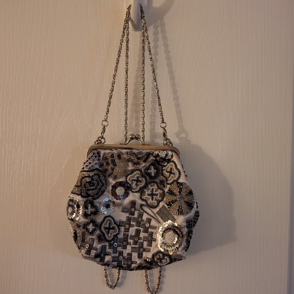 Chic Black and Silver Clutch with Intricate Floral Design